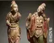  ??  ?? Rare ensemble de deux statuettes de boddhisatt­va debout en bois et traces de polychromi­e – Chine, Epoque MING (-) - H :  cm et H :  cm - Adjugé :   €.