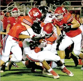  ?? RICK PECK/MCDONALD COUNTY PRESS ?? McDonald County running back Isrrael De Santiago gets tackled by the head during the Mustangs’ 49-13 loss to Carl Junction on Oct. 20 at Carl Junction High School.