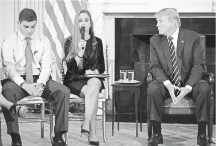  ?? MANDEL NGAN/AFP/GETTY IMAGES ?? President Trump held a listening session on gun violence during which he heard from Parkland, Fla., students Julia Cordover and Jonathan Blank on Wednesday at the White House.