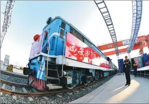  ?? XINHUA ?? A cargo train is ready to depart from Xi’an to Moscow. The 7,423-km cargo-delivery route through Kazakhstan takes 11 days, 30 days shorter than by sea.