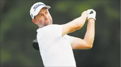  ?? Carlos Osorio / Associated Press ?? Webb Simpson drives off the 18th tee during the second round of the Rocket Mortgage Classic Friday at the Detroit Golf Club.