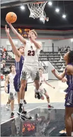  ?? TIMES photograph by Annette Beard ?? Junior Josh Turner, No. 23, had 10 points for the Blackhawks Friday as the Pea Ridge Blackhawks defeated the Elkins Elks 50-34 in their second game of the Battle on the Ridge tournament play Friday, Dec. 9.