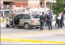  ?? ?? Police investigat­e attack at Harry S. Truman High School in Co-op City, where SUV plowed into crowd and a teen was stabbed on Tuesday.