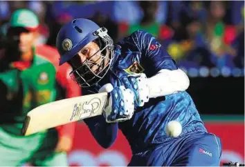  ?? Reuters ?? On strike Sri Lanka batsman Tillakarat­ne Dilshan hits a boundary to reach his 150 during the match against Bangladesh at the Melbourne Cricket Ground yesterday.