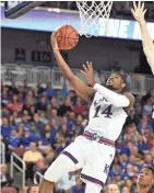  ??  ?? Kansas guard Malik Newman shoots against Pennsylvan­ia forward AJ Brodeur during Thursday’s first round game of the 2018 NCAA Tournament at INTRUST Bank Arena. KELLY ROSS/USA TODAY SPORTS