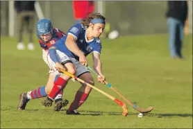  ??  ?? Kyles Athletic’s Andrew King resists the challenge from Kingussie’s James Falconer.