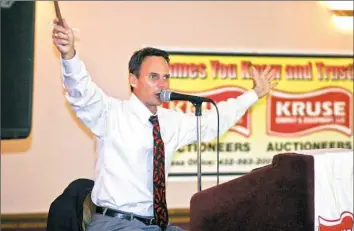  ??  ?? Longtime auctioneer Jim Richie keeps the rhythm with a nearly endless string of numbers, sounds and the occasional joke.