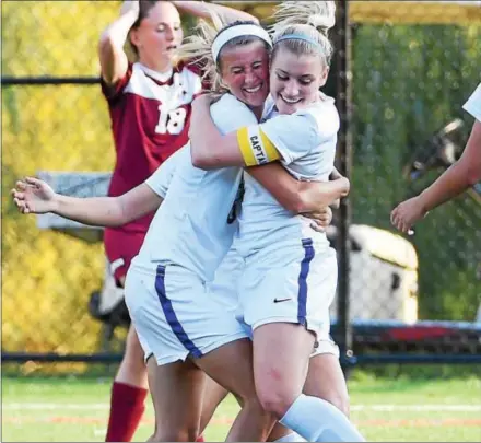  ?? PETE BANNAN — DIGITAL FIRST MEDIA ?? Downingtow­n East’s Jess Keeler (6) celebrates her game-winning goal with Emma Steigerwal­d in Wednesday’s Ches-Mont League National Division girls soccer match against West Chester Henderson.