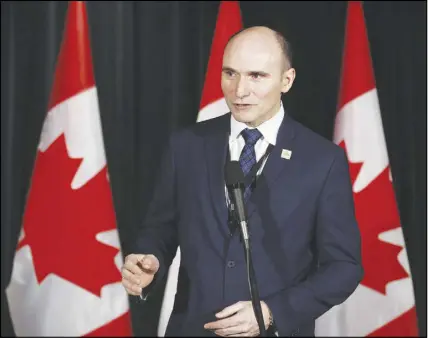  ?? CP photo ?? Minister of Families, Children and Social Developmen­t Jean-yves Duclos speaks to reporters at a Liberal cabinet retreat in Calgary, Alta. Some disabled Canadians fighting for government benefits are being forced by a federal tribunal to hire lawyers.