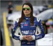  ?? CHUCK BURTON - THE ASSOCIATED PRESS ?? In this Thursday, May 25, 2017 file photo, Danica Patrick stands by her car before qualifying for Sunday’s NASCAR Cup series auto race at Charlotte Motor Speedway in Concord, N.C. Danica Patrick is done at Stewart-Haas Racing and her future in NASCAR...