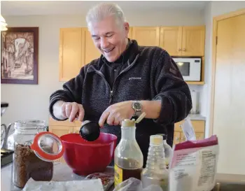  ?? JEFF MCLNTOSH/THE CANADIAN PRESS ?? Roger Marple, who was was diagnosed with early-onset Alzheimer in 2015 at age 57, bakes butter tarts in his apartment in Medicine Hat, Alta., last Friday.