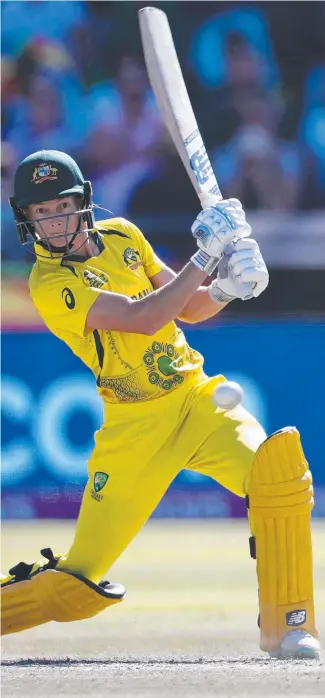  ?? ?? Meg Lanning hits a drive during the final of the T20 women's World Cup.