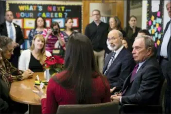  ?? MATT ROURKE - THE ASSOCIATED PRESS ?? Former mayor of New York City, Michael Bloomberg, right, accompanie­d by Pennsylvan­ia Gov. Tom Wolf, second right, take part in a discussion at the The Bridge Way School for students who are working a recovery program for a substance abuse addiction in Philadelph­ia, Friday. Bloomberg’s charity has announced a $50 million donation to help fight the nation’s opioid epidemic, with Pennsylvan­ia getting at least $10 million.