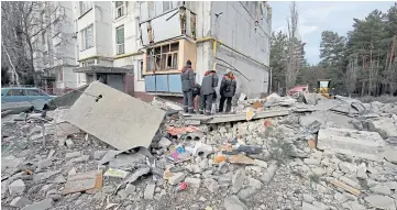  ?? In Kharkiv. ?? Rescuers work at an apartment building destroyed in a Russian rocket strike