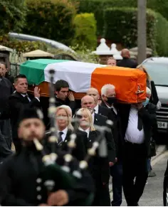  ??  ?? ‘PROFILE EVENT’: The funeral of senior republican Bobby Storey was widely criticised for disregardi­ng social distancing rules