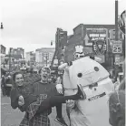  ??  ?? Participan­ts enjoy the 2017 edition of the Silky O’ Sullivan Beale Street St. Patrick’s Day Parade.