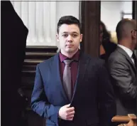  ?? Pool / Getty Images ?? Kyle Rittenhous­e enters the courtroom to hear the verdicts in his trial prior to being found not guilty on all counts at the courthouse on Friday in Kenosha, Wisconsin.