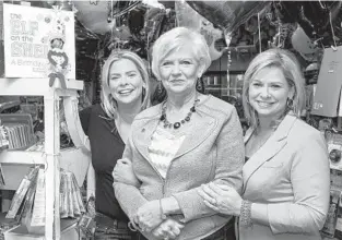  ?? TAYLOR HILL GETTY IMAGES ?? “Everyone in our company works for Santa Claus,” said founder and CO-CEO Christa Pitts (left), with her mother, Carol Aebersold, and sister, Chanda A. Bell.