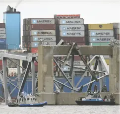  ?? JIM WATSON / AFP VIA GETTY IMAGES ?? Recovery crews work near the collapsed Francis Scott Key Bridge after it was struck by a cargo ship on Tuesday.