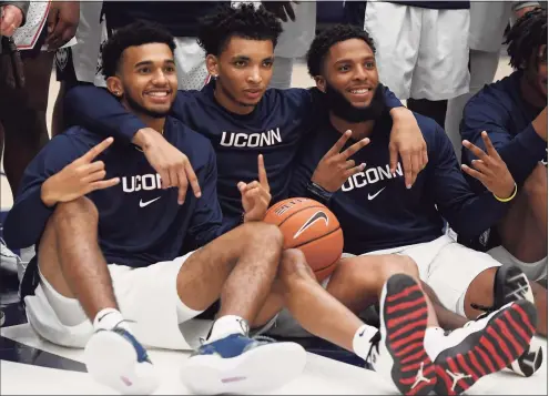  ?? Jessica Hill / Associated Press ?? From left, UConn’s Jalen Gaffney, James Bouknight and R.J. Cole react during UConn’s First Night celebratio­n in October.