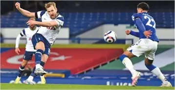  ?? AFP ?? Tottenham Hotspur’s Harry Kane (left) scores his team’s second goal against Everton during their English Premier League match at Goodison Park in Liverpool on Friday. —