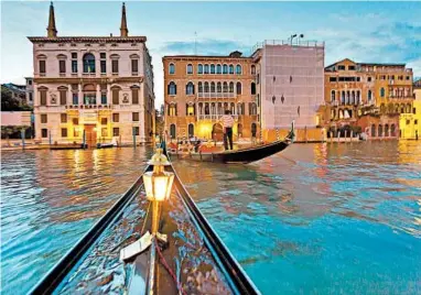  ?? DOMINIC ARIZONA BONUCCELLI/RICK STEVES’ EUROPE PHOTOS ?? Though expensive, riding a gondola at night is one of the great European experience­s.