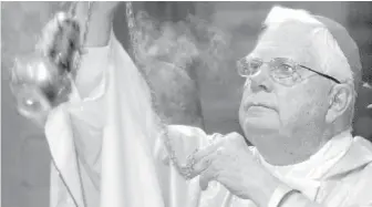  ??  ?? Cardinal Bernard Law celebrates Mass in Rome in 2004. An official with the Catholic Church said this week that the disgraced former archbishop of Boston has died at 86.