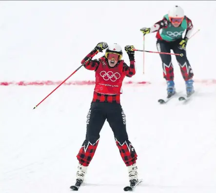  ?? RYAN PIERSE/GETTY IMAGES ?? Kelowna, B.C.’s Kelsey Serwa celebrates winning gold in ski cross Friday at the Pyeongchan­g Winter Games as teammate Brittany Phelan of Mont-Tremblant, Que., crosses the finish line for silver. Four Canadians took part in the event.