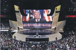  ?? PATRICK SEMANSKY — THE ASSOCIATED PRESS FILE ?? Republican presidenti­al candidate Donald Trump smiles as he addresses delegates during the final day session of the Republican National Convention in Cleveland.