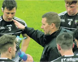  ??  ?? INSTRUCTIO­NS: Sligo boss Tony McEntee talks to his players during the first-half water break at Corrigan Park, Belfast, last Sunday. BELOW: McEntee involved in a conversati­on before the game against Antrim.