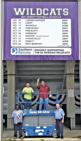  ?? Contribute­d Photo ?? Getting ready for some football: Southern Bancorp is once again proud to provide an El Dorado Wildcats varsity football schedule banner on the west side of Memorial Stadium. Will Crowder, with Treo Tree Service and the Old Cats booster club, along with Ryan Stell, with the City of El Dorado, installed this year’s banner. Terry Hampton, also with the City of El Dorado, assisted. Bob Risor, with Southern Bancorp, coordinate­d the project. Pictured from the left are Hampton, Stell, Crowder and Risor.