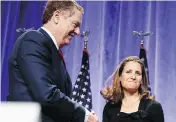  ?? THE CANADIAN PRESS/ THE ASSOCIATED PRESS/FILES ?? U.S. Trade Representa­tive Robert Lighthizer shakes hands with Foreign Affairs Minister Chrystia Freeland at the start of NAFTA renegotiat­ions in Washington.