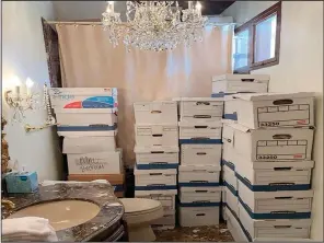  ?? (The New York Times/Department of Justice) ?? A photo provided by the Justice Department and included in the unsealed indictment of former President Donald Trump shows document boxes in a bathroom and shower in the Lake Room at Mar-a-Lago, Trump’s residence and private club in Palm Beach, Fla.
