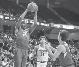  ?? The Associated Press ?? MANNY MOMENT: Manny Watkins brings down a rebound against Texas A&M and scores nine points, all on three-point baskets, as Arkansas nips the Aggies 62-60 Tuesday night at College Station, Texas. LSU plays Arkansas at 7:30 tonight at Walton Arena in...