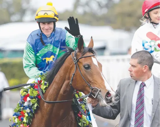  ?? Picture: PETER WALLIS ?? Evergreen jockey Jeff Lloyd celebrates his Group 1 win on Pear Tart in the 2012 Tatt’s Tiara at Eagle Farm.