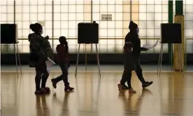  ?? Photograph: David Maxwell/EPA ?? Voters cast their ballots in Cleveland on 3 November.