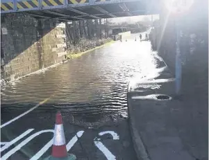  ??  ?? Water woe Old Edinburgh Road in Bridge of Earn flooded after torrential rain during Storm Ciara