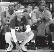  ?? ASSOCIATED PRESS ?? 3’S COMPANY PLAYER/CAPTAIN AND COACH Allen Iverson (center) kneels on the sideline during the first half of Game 3 in the BIG3 Basketball League debut Sunday at the Barclays Center in New York.