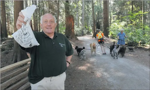  ?? WAYNE LEIDENFROS­T/PNG ?? Raymond Greenwood, a Vancouver resident and proponent of the red bin dog waste-disposal program at Pacific Spirit Regional Park, says: ‘Here we are doing such a good job on the food waste, so why aren’t we doing it for dog waste when it’s so easy to do?’
