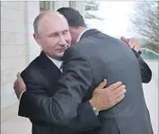  ?? Mikhail Klimentyev Sputnik ?? RUSSIAN President Vladimir Putin and Syrian President Bashar Assad embrace in Sochi on Monday.