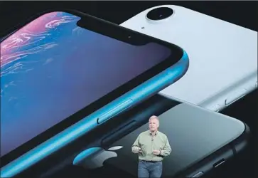  ?? Justin Sullivan Getty Images ?? APPLE HAS filed a motion to compel Qualcomm to show evidence that substantia­tes its allegation­s. Above, Apple marketing chief Phil Schiller at a presentati­on in Cupertino, Calif., this month.