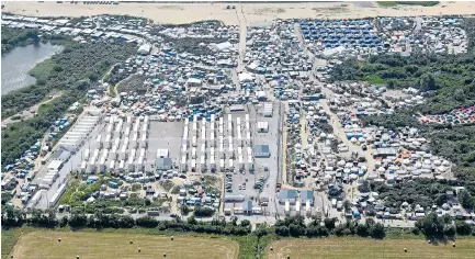  ?? Pictures: STEVE FINN, FRANCOIS LO PRESTI / AFP ?? More than 6,000 people live in the shanty town camp near Calais but French officials are planning to flatten it