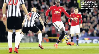  ??  ?? Jonjo Shelvey in action during the match...with some unusual socks