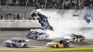  ?? TERRY RENNA / AP ?? Ryan Newman (6) goes airborne as he collided with Corey LaJoie (32) on the final lap. NASCAR tweeted that Newman “is in serious condition, but doctors have indicated his injuries are not life threatenin­g.”