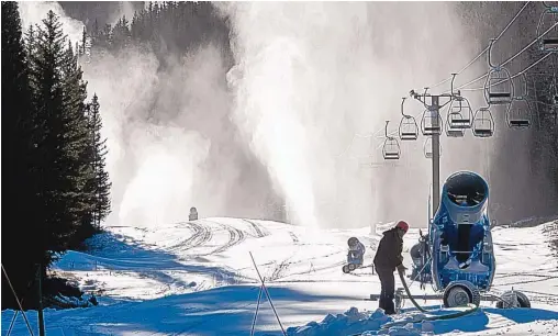  ?? EDDIE MOORE/JOURNAL ?? Ski Santa Fe prepares Tuesday for its opening by blasting snow from machines onto runs. The ski area plans to open over the Thanksgivi­ng holiday, as does the Taos Ski Valley. Sipapu opened Friday.