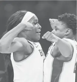  ?? CARMEN MANDATO/GETTY ?? Baylor’s Queen Egbo, left, and Moon Ursin, right, celebrate their 78-75 win over Michigan in the Sweet 16 of the NCAA Tournament on Saturday at the Alamodome in San Antonio, Texas.