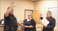  ?? / Kevin Myrick, SJ File ?? This file photo shows former Chief Mark Riley being sworn in to his duties as head of the Aragon Police Department. Now a sergeant, he in recent days was made the character of a local man’s song.