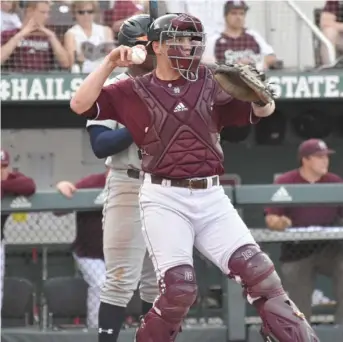  ?? SDN) (Photo by Jason Cleveland, ?? Catcher Josh Lovelady comes up ready to throw for the Bulldogs on Friday.