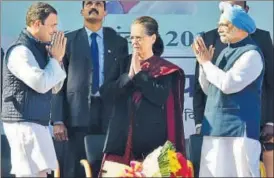  ?? PTI PHOTO ?? Newly elected Congress president Rahul Gandhi greets his mother Sonia Gandhi and former prime minister Manmohan Singh in New Delhi on Saturday.