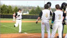  ?? Contribute­d by Shelly Culver ?? Dylan Bailey was greeted at home plate after scoring a grand slam on a home run against Chattooga.